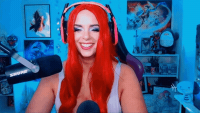Red-Haired Woman Smiling At Microphone GIF