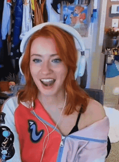 Red-Haired Woman Smiling In Headphones GIF