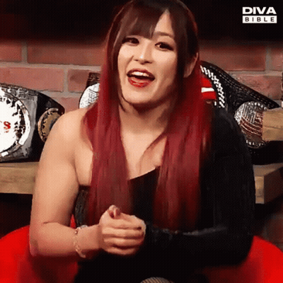 Red-Haired Woman Smiling With Diva Bible Championship Belts GIF
