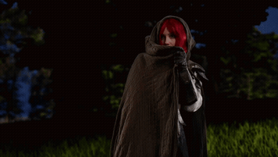 Red-Haired Woman Standing In Field With Lurking GIF