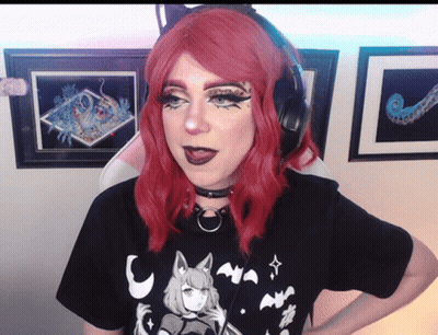 Red-Haired Woman With Headphones And Black T-Shirt GIF