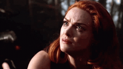Red-Haired Woman With Tear On Cheek GIF