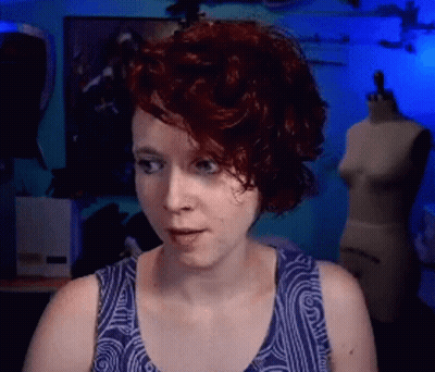 Red-Haired Woman With Wrestling Belt And Gloves Funny Face GIF