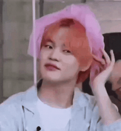 Red-Haired Young Man in Pink Hat Making Funny Face
