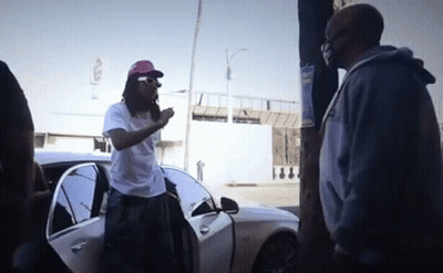 Red Hat Man And Blue Hoodie Man By White Car GIF