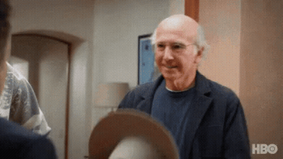 Red Hat Man Talking In Grocery Store GIF