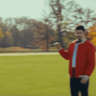 Red Jacket Man Holding Sword In Field GIF