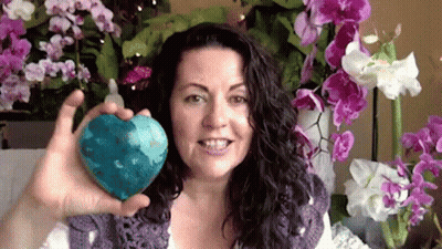 Red Jacket Woman Sitting With Microphone And Water GIF
