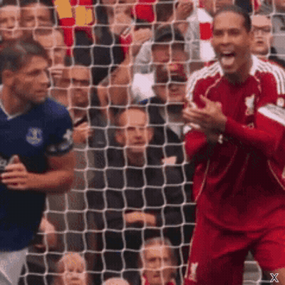 Red Jersey Player Celebrating Goal Blue Player Watching GIF