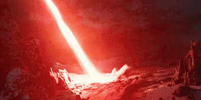 Red Light Coming Out Of Volcano In Night Sky GIF