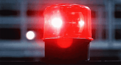 Red Light Lit Up In Darkness GIF