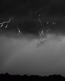 Red Lightning Slowly Crawls Down Sky GIF