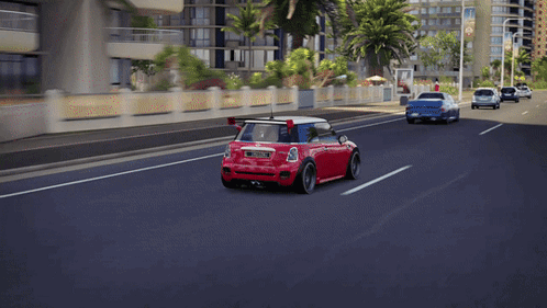 Red Mini Cooper With License Plate JCW Driving Down Street GIF