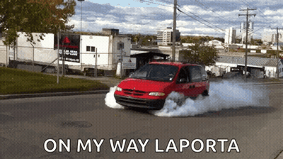 Red Minivan Driving With Smoke Saying On My Way Laporta GIF