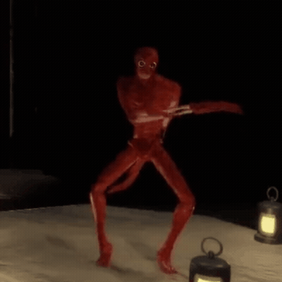 Red Monster Standing On Bed Next To Lantern GIF