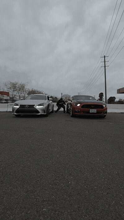 Red Mustang And White Lexus Parked Next To Each Other GIF