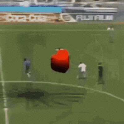 Red Object Flying Over Coca-Cola Soccer Field GIF