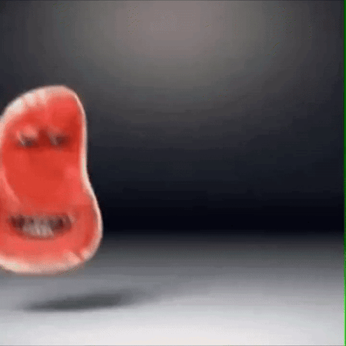 Red Object With Face Floating On White Surface GIF