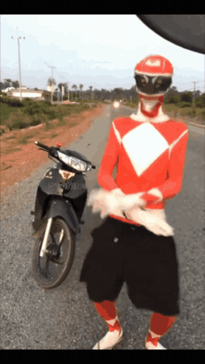 Red Power Ranger Standing Next To Motorcycle GIF