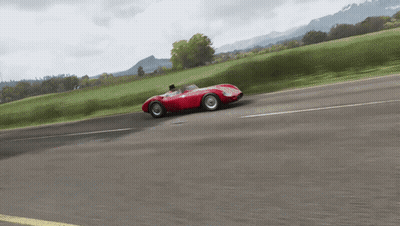 Red Race Car Driving Down Mountain Road GIF