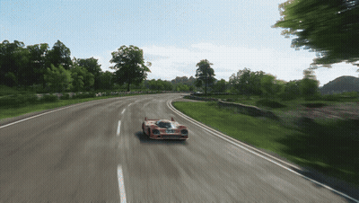 Red Race Car Driving On Road With Trees GIF
