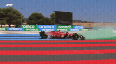 Red Race Car On Track With Aramco Banners GIF