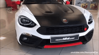 Red Renault Car Parked In Showroom GIF