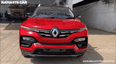 Red Renault Parked In Front Of Namaste Car Store GIF