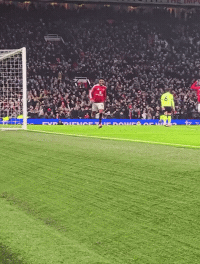 Red Shirt Man At Podium With In Jamad Sign GIF