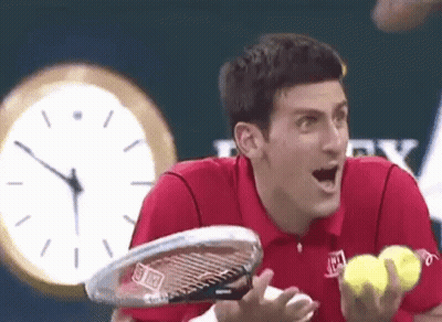 Red Shirt Man Holding Tennis Racquet And Balls GIF