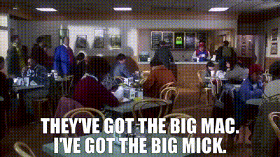 Red Shirt Man Next To Black Shirt Man GIF
