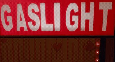 Red Sign Saying Gaslight 7 Lit Up GIF