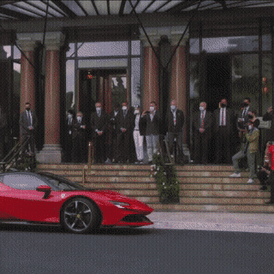 Red Sports Car And Group Of People GIF