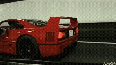 Red Sports Car Driving Down Road Autogifs GIF