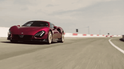 Red Sports Car Driving Down Road GIF