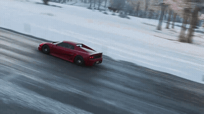 Red Sports Car Driving Down Snowy Road GIF