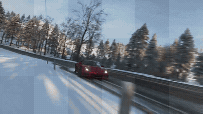 Red Sports Car Driving On Snowy Road GIF