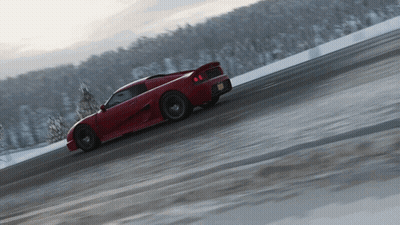 Red Sports Car Driving On Snowy Road GIF