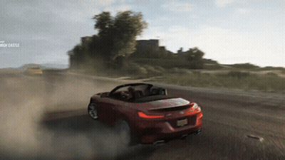 Red Sports Car On Dirt Road With Church Castle GIF