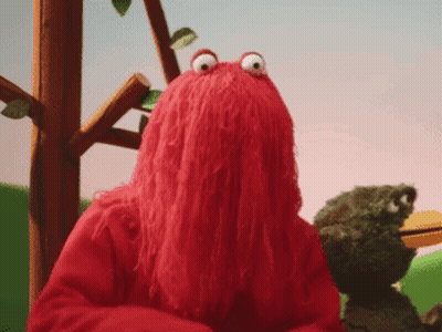 Red Stuffed Animal With Frog Behind GIF