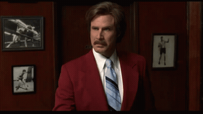 Red Suit Man Holding Paper With Blue Tie GIF