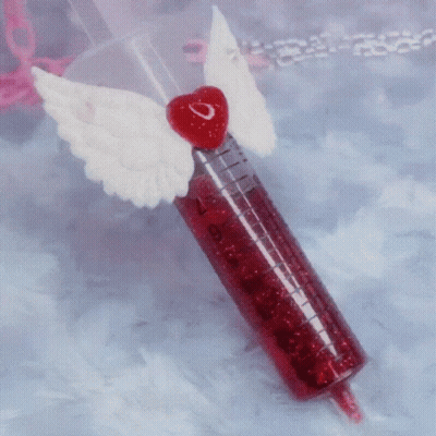 Red Syringe With White Wings And Heart GIF