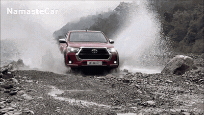 Red Toyota Truck Driving Through Muddy River With Namaste Car GIF