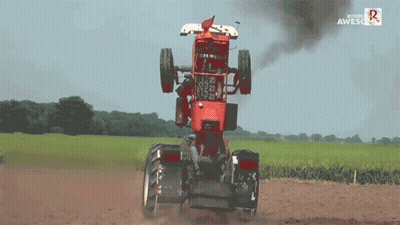 Red Tractor Driving Through Field Saying Awesome GIF