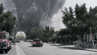 Red Truck Parked Beside Smoke Cloud GIF