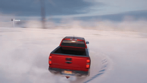 Red Truck With New York License Plate Driving Through Snow GIF