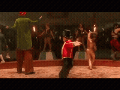 Red Uniform Man Dancing With Circus Clown Behind GIF