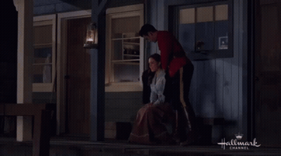 Red Uniform Man Sitting Beside Black Sweater Woman GIF