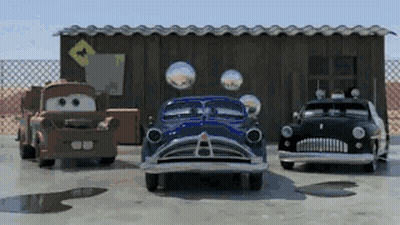 Red Volvo Driving Down Road At Night GIF