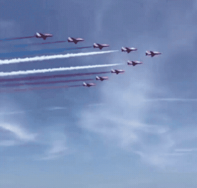 Red White And Blue Jets Flying Over A Crowd GIF